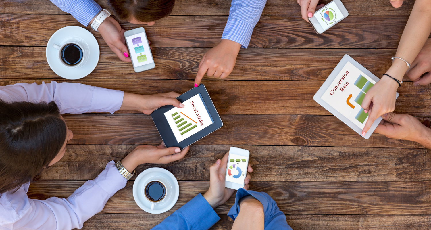 People analyze social media and conversion data on mobile devices