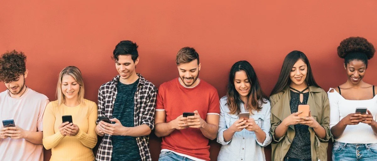 A group of people uses smartphones