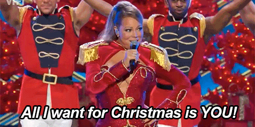 Mariah Carey sings in front of dancers; "All I Want for Christmas Is You" plays in the background!
