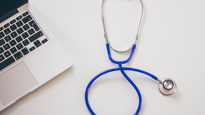 A laptop and a stethoscope as symbols of a GDPR assessment