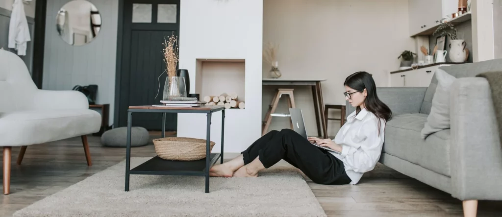 A woman works on her laptop while working from home