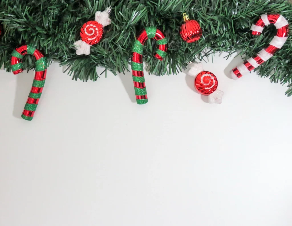 Christmas garland with red and green candy canes and Christmas tree ornaments
