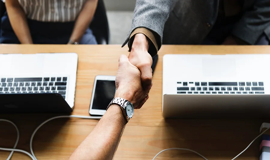 A handshake at a business meeting as a symbol of partnership