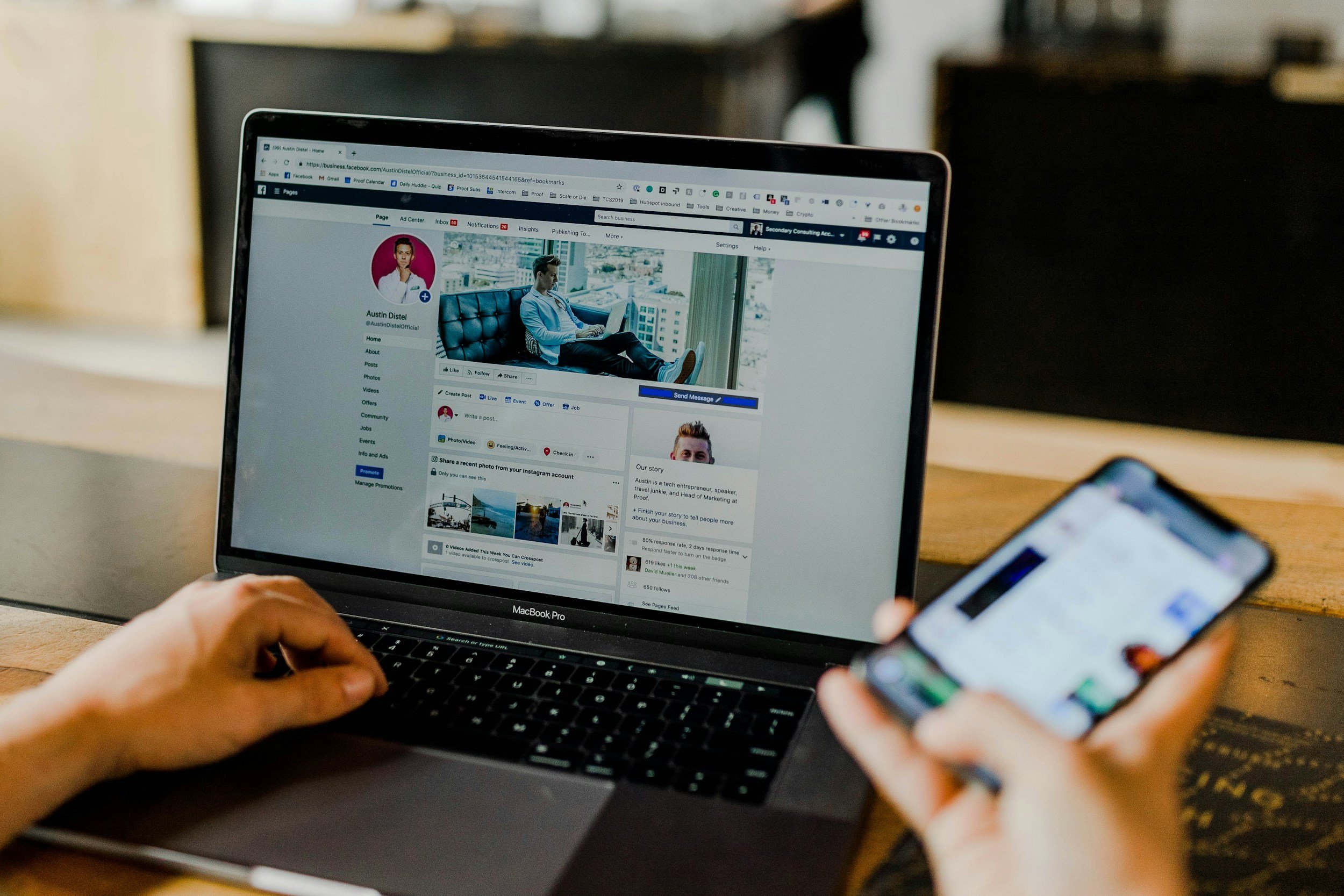 A Facebook business page on a laptop next to a smartphone